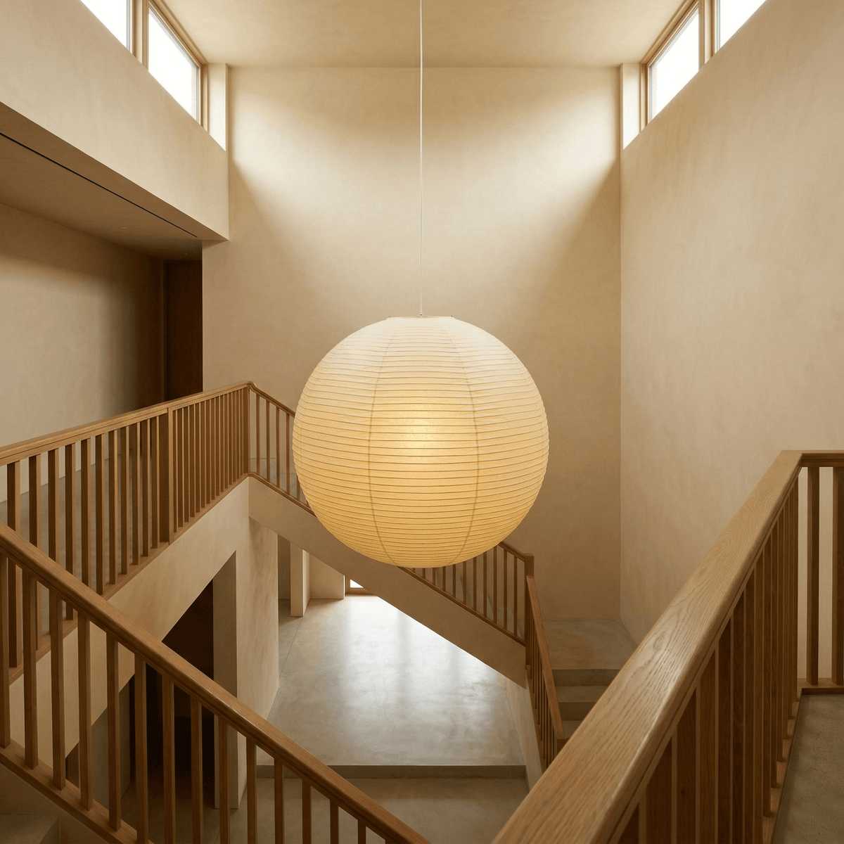 Spherical pendant light with a ribbed globe shade suspended from a ceiling