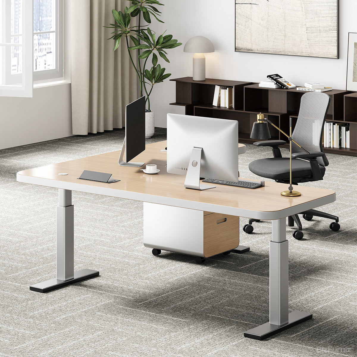 L-shaped natural wood-effect sit-stand office desk with power hub and mobile three-drawer cabinet