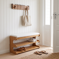 Bamboo shoe bench with white padded seat and two open storage shelves