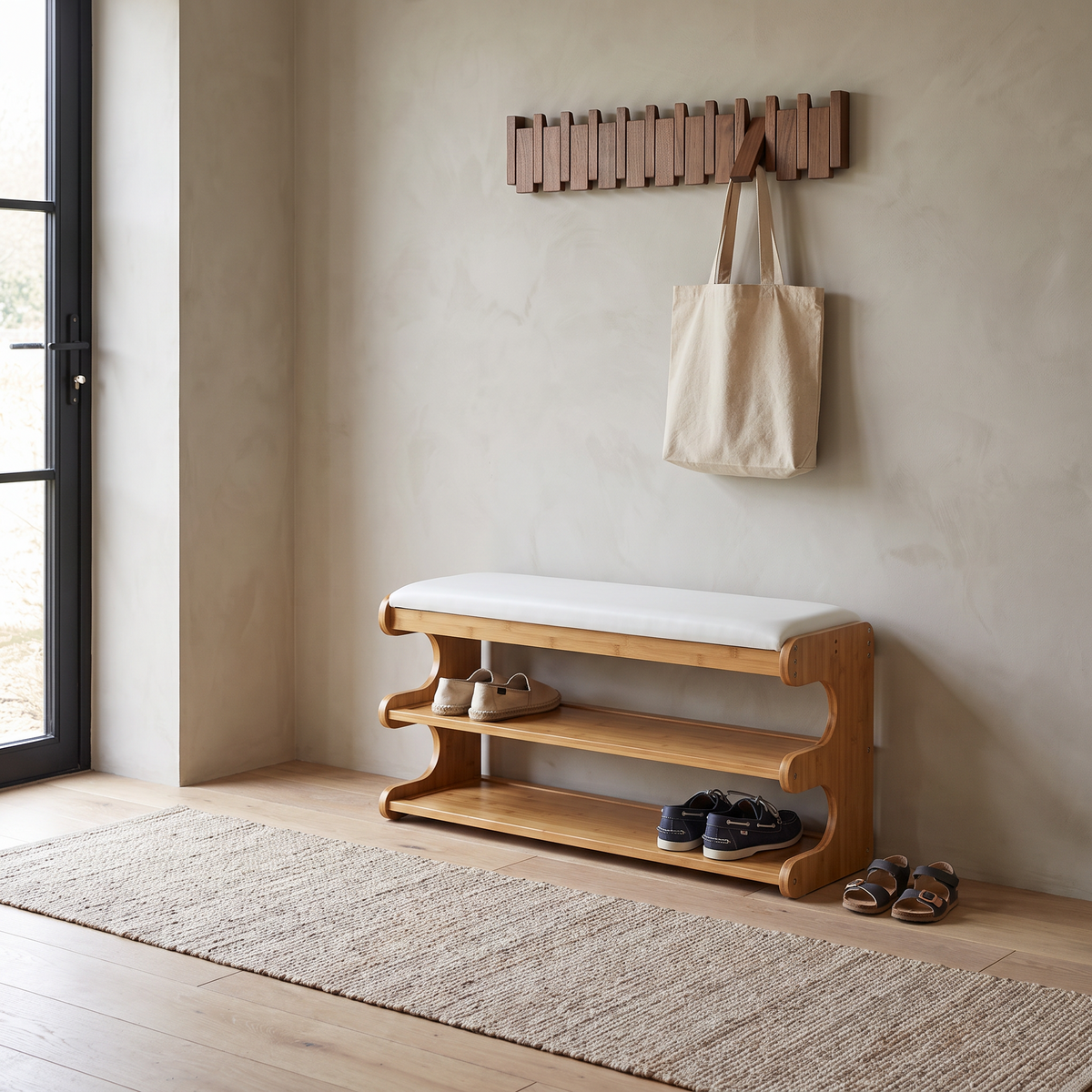 Bamboo shoe bench with white padded seat and two open storage shelves