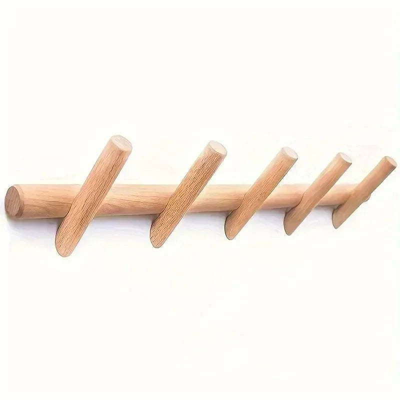 Light-brown wooden wall-mounted coat rack with multiple rounded pegs