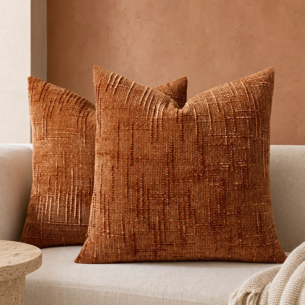 Textured geometric throw pillow with a woven chenille-style finish