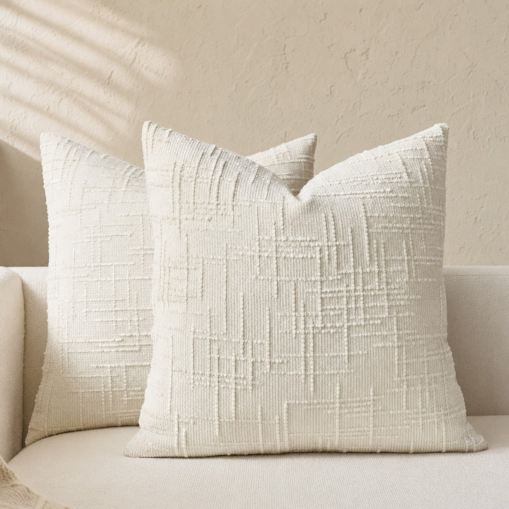 Textured geometric throw pillow with a woven chenille-style finish