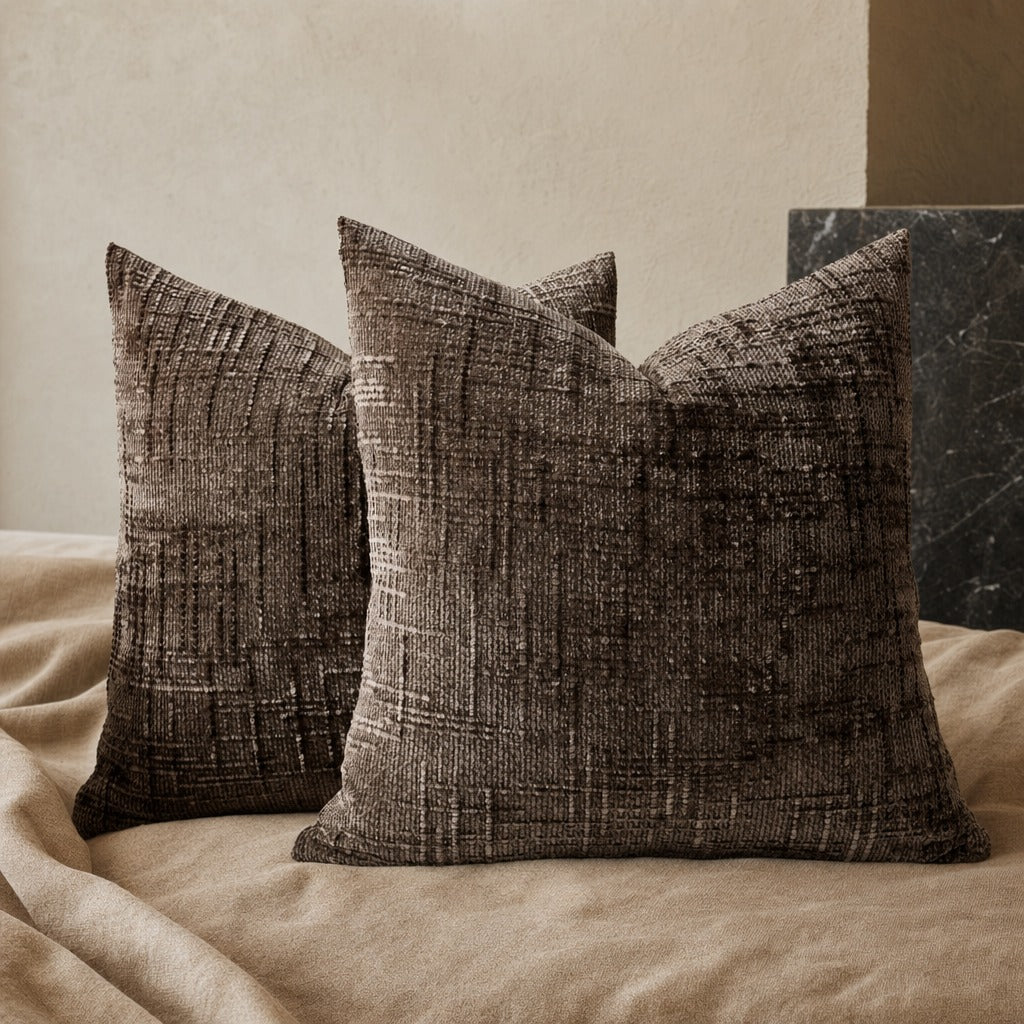 Textured geometric throw pillow with a woven chenille-style finish