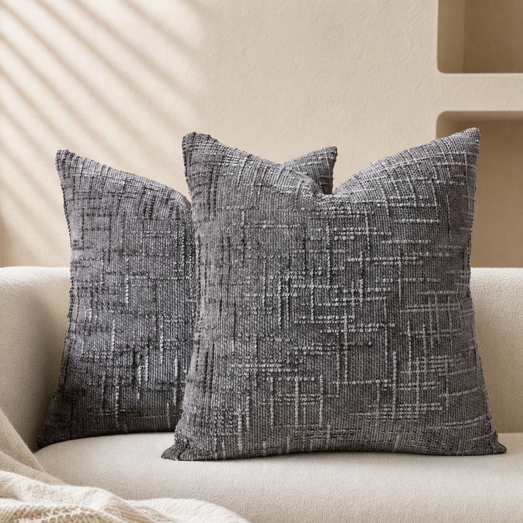 Textured geometric throw pillow with a woven chenille-style finish