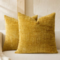 Textured geometric throw pillow with a woven chenille-style finish