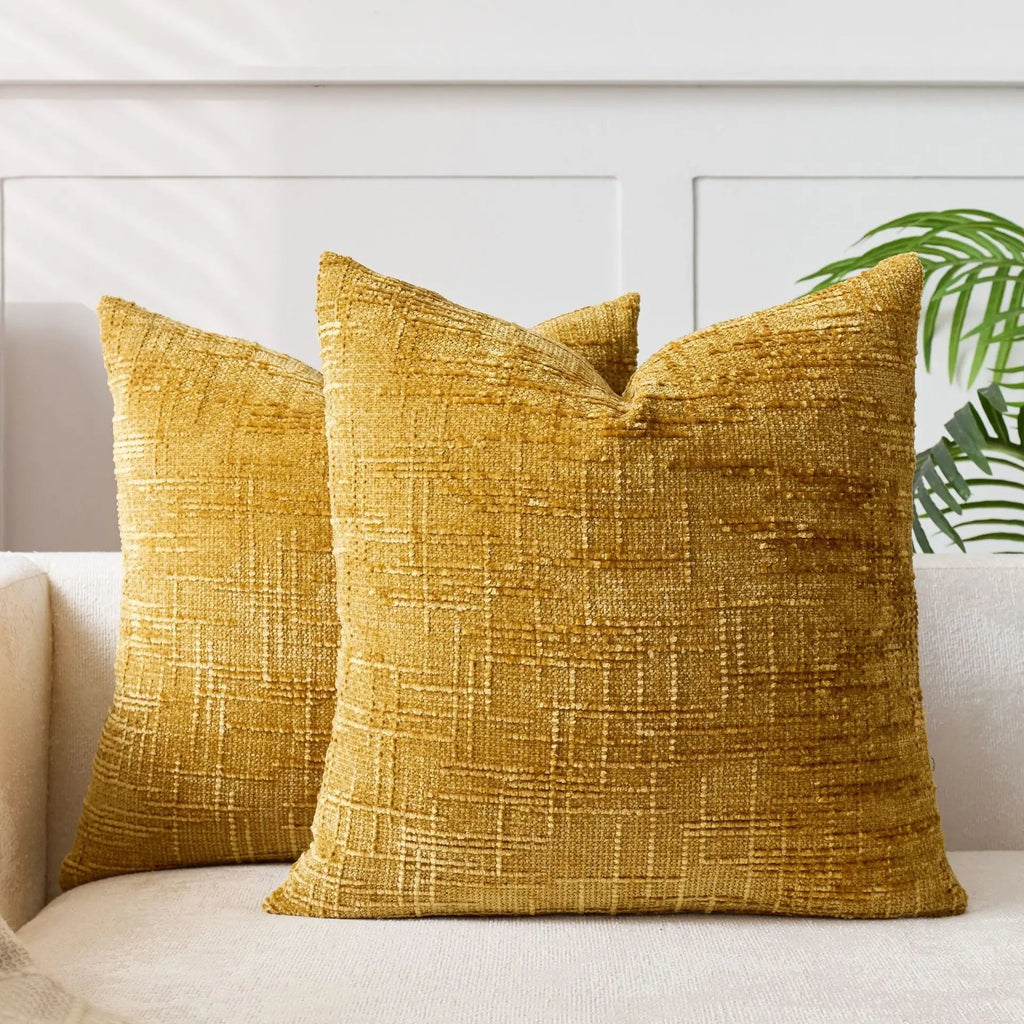 Textured geometric throw pillow with a woven chenille-style finish