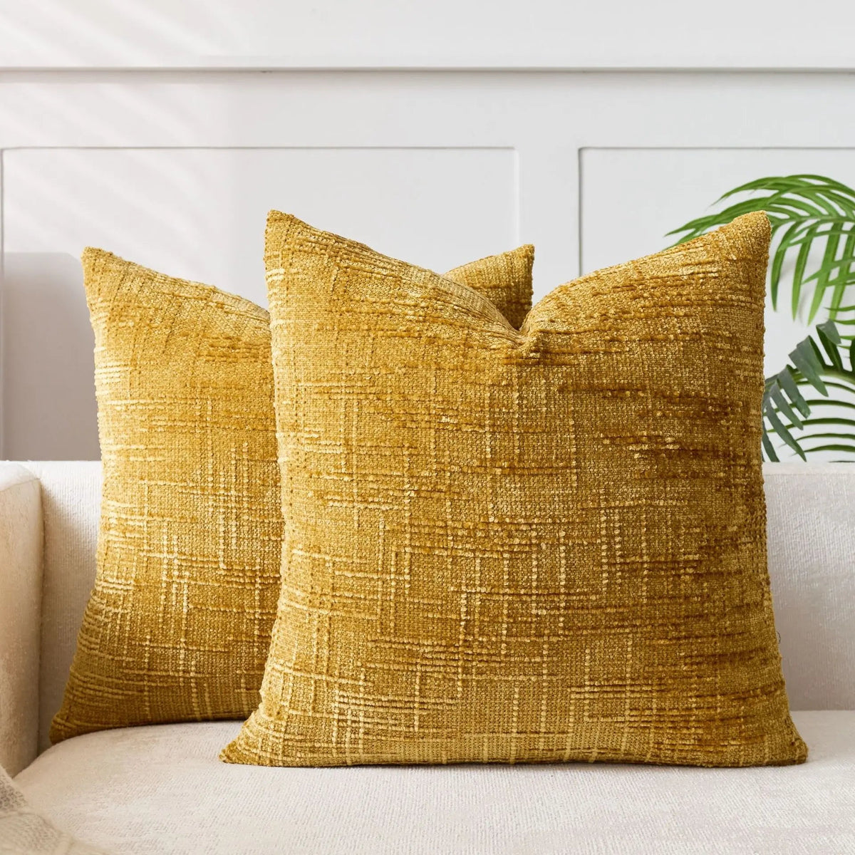 Textured geometric throw pillow with a woven chenille-style finish