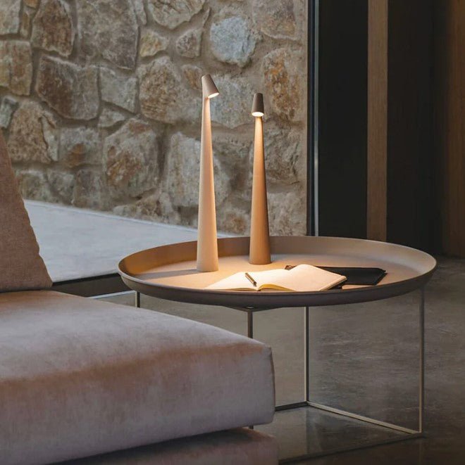 Cordless conical LED table lamp with angled light head