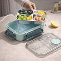 Divided food container with separate sections and transparent lid