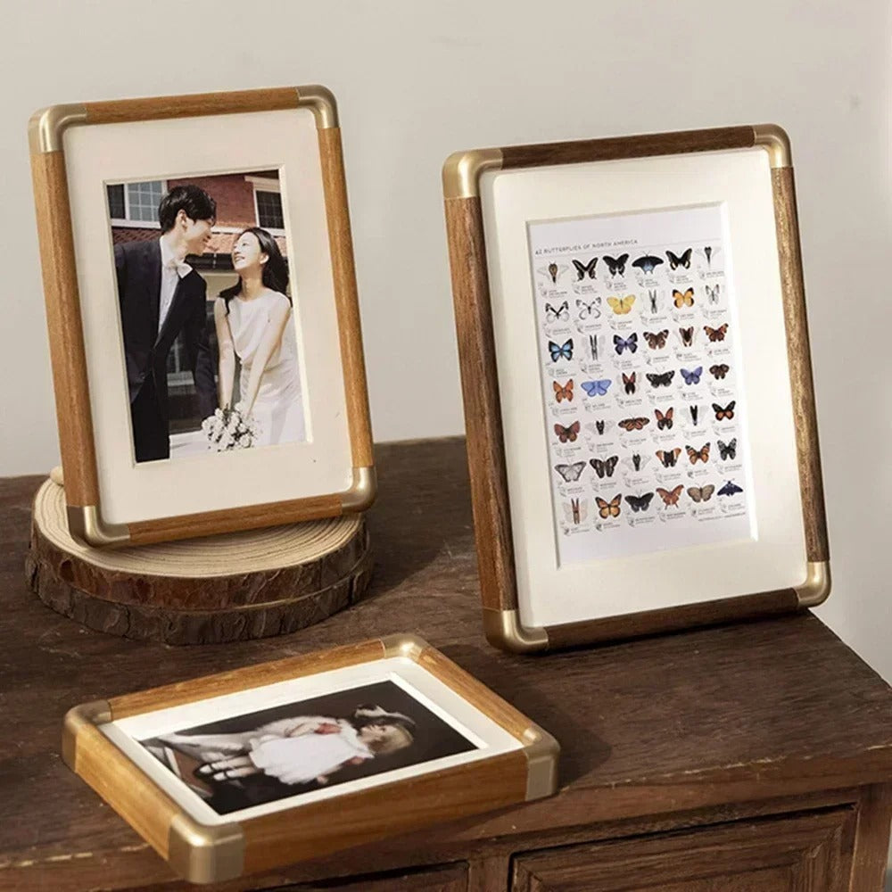 Tabletop photo frame with wood and brass-effect border