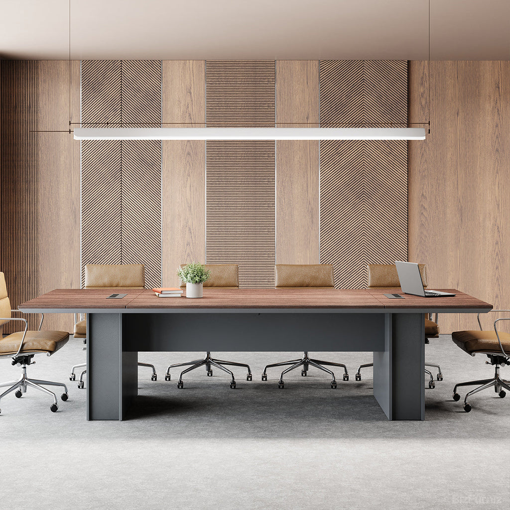 Large brown wood-effect conference table with grey base and cable management