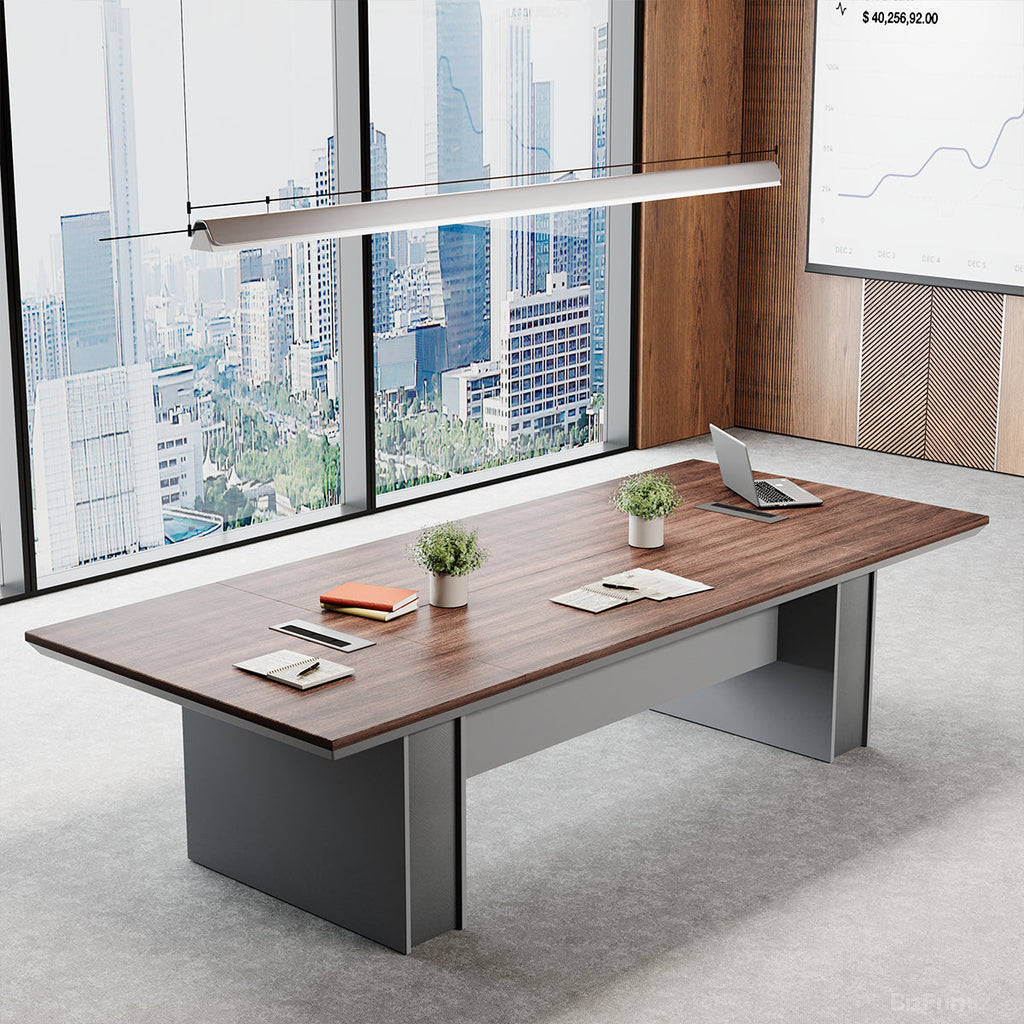Large brown wood-effect conference table with grey base and cable management