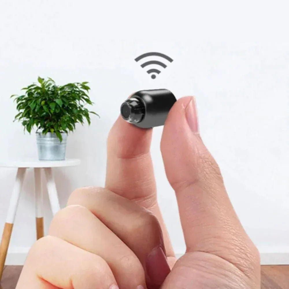 Compact black mini camera with front lens and integrated base