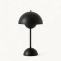 Mushroom-style table lamp with dome shade, slim stem and rounded base