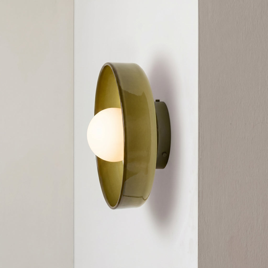 Rounded glass flush ceiling light with central white spherical diffuser