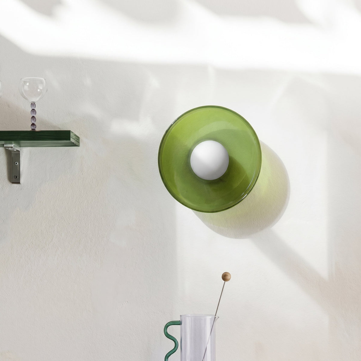 Rounded glass flush ceiling light with central white spherical diffuser