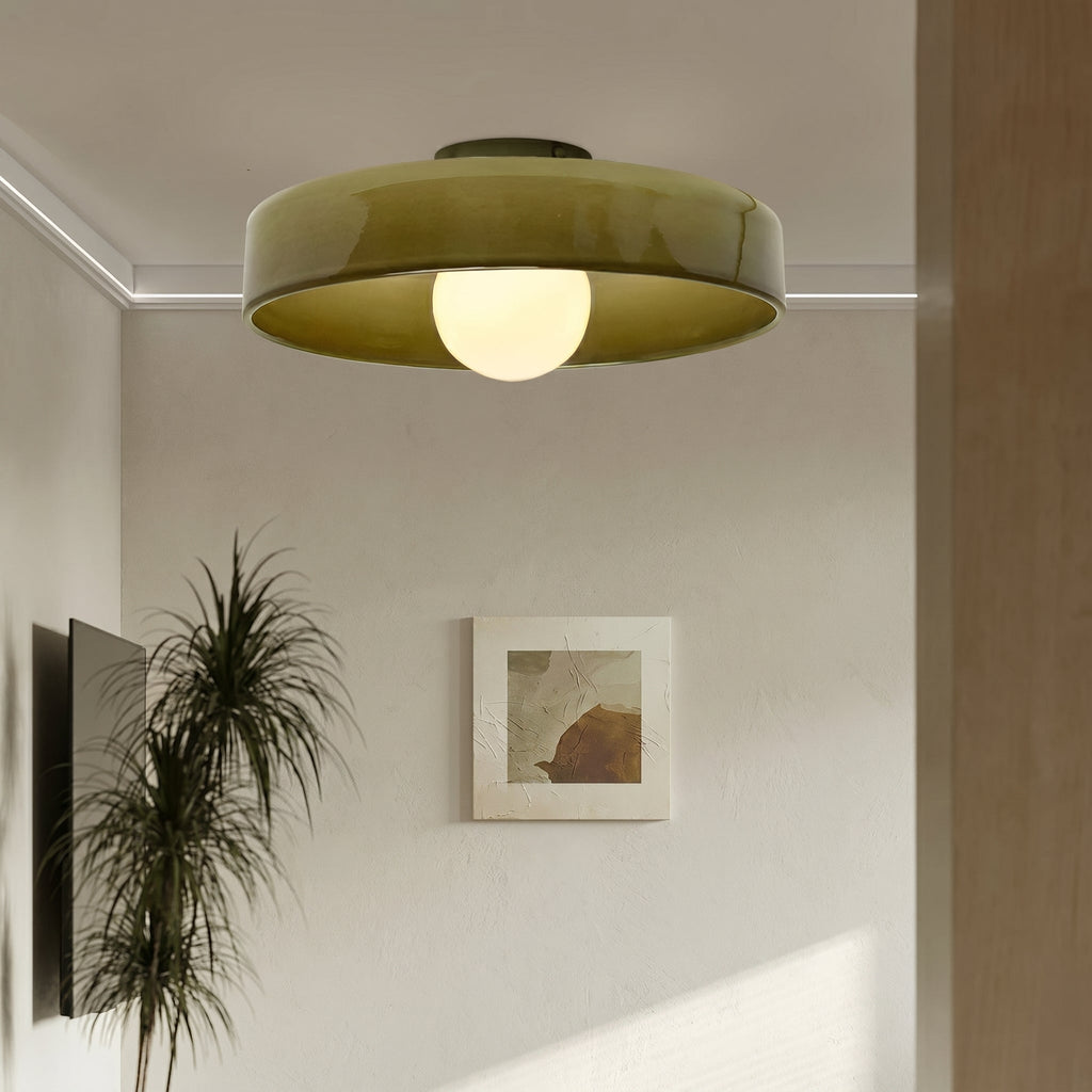 Rounded glass flush ceiling light with central white spherical diffuser