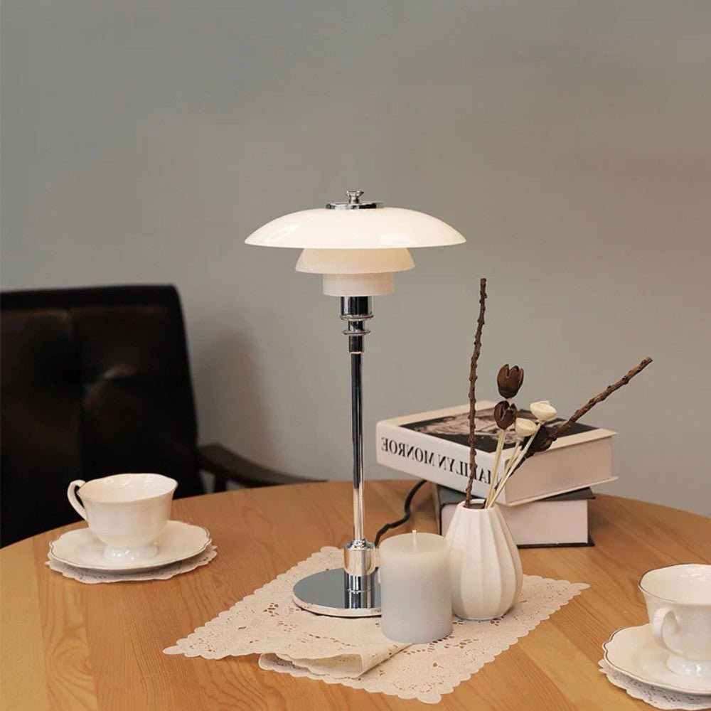 Layered glass table lamp with dome shade, slim metal stem and round base