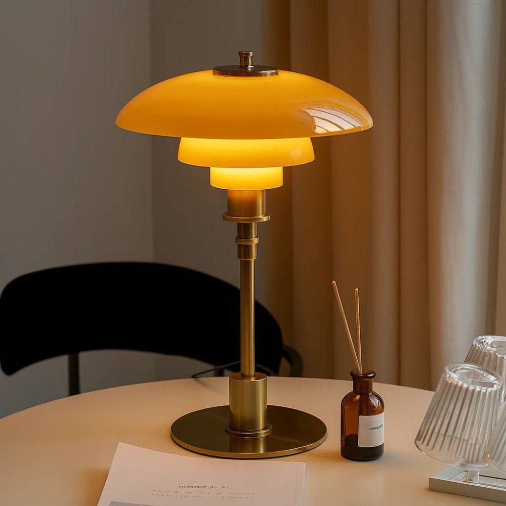 Layered glass table lamp with dome shade, slim metal stem and round base