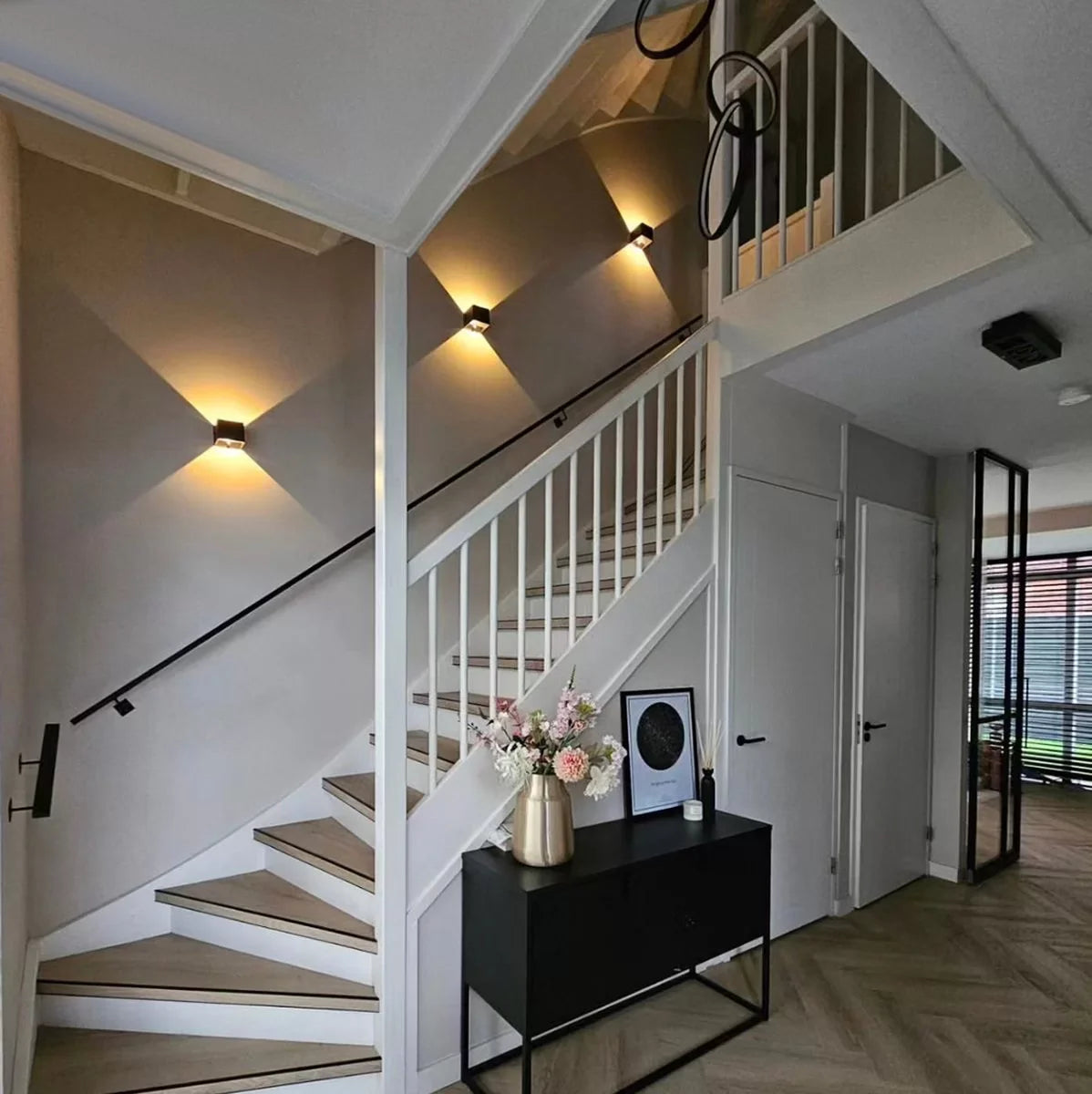 Geometric LED wall light projecting light upwards and downwards
