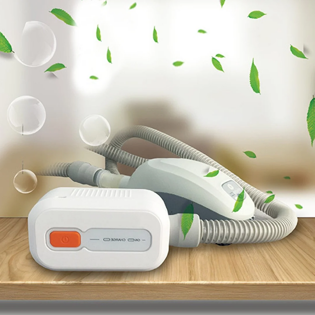 White ozone-based CPAP cleaning system with orange control button and connected hose