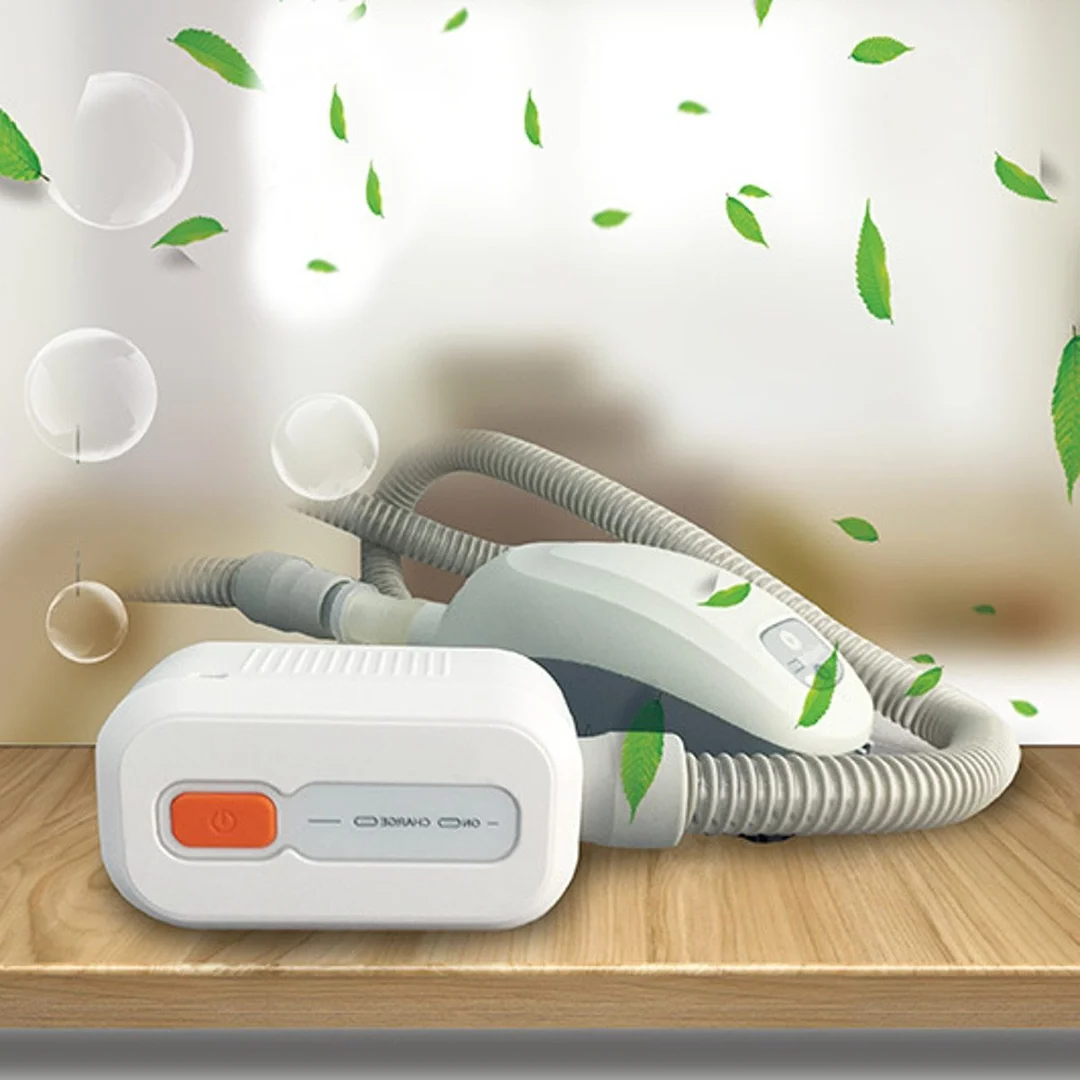 White ozone-based CPAP cleaning system with orange control button and connected hose