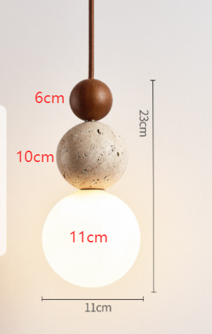 Pendant ceiling light with three stacked spherical details and a hanging cord