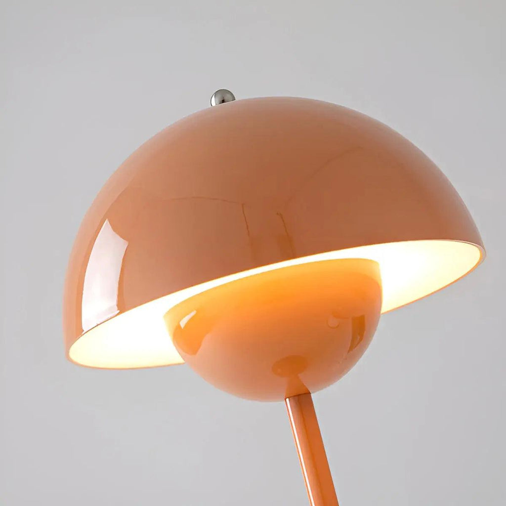 Dimmable modern table lamp with a rounded dome shade and slim stem