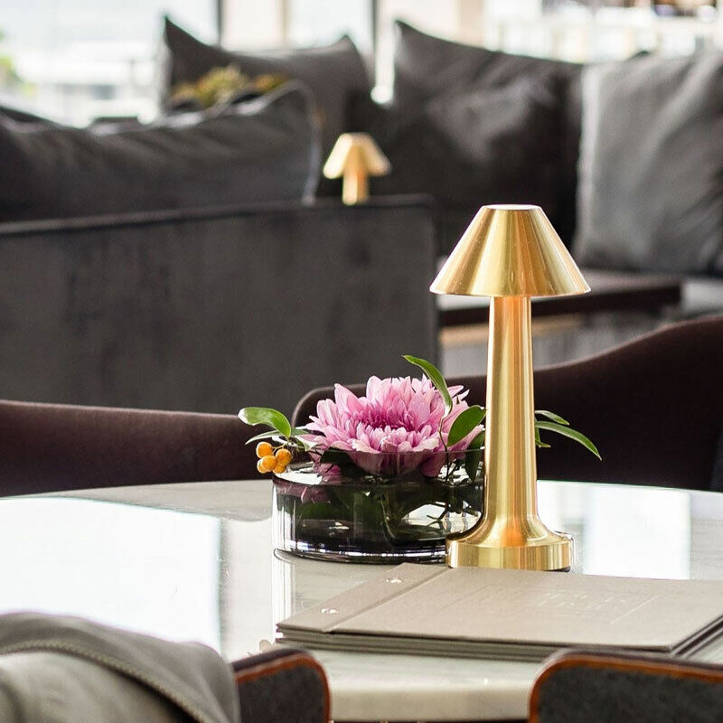 Table lamp with cylindrical shade, slim stem and round base