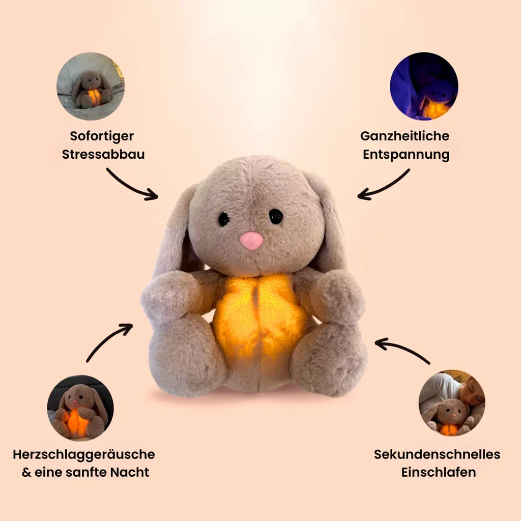 Grey rabbit stuffed animal with floppy ears and illuminated yellow belly