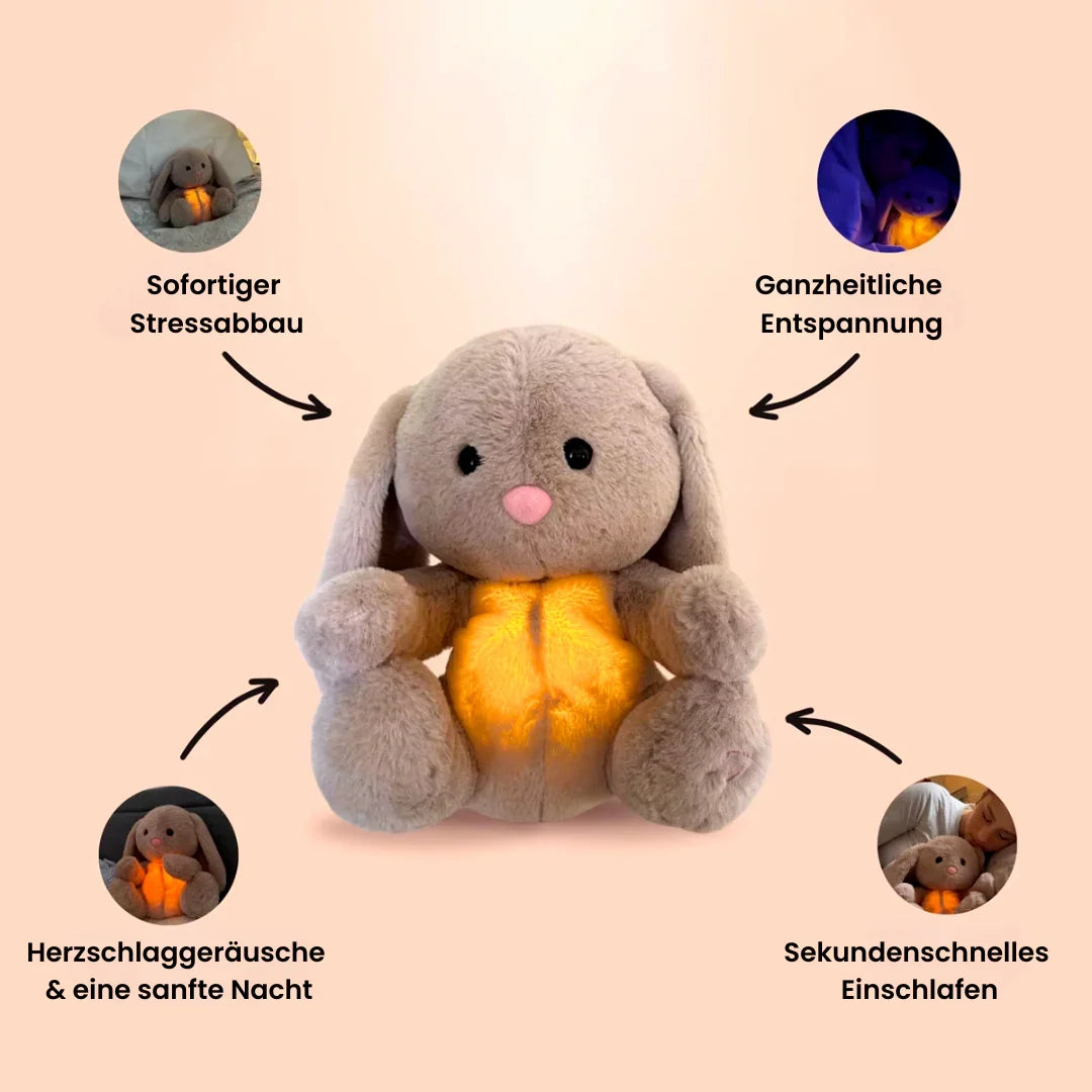 Grey rabbit stuffed animal with floppy ears and illuminated yellow belly