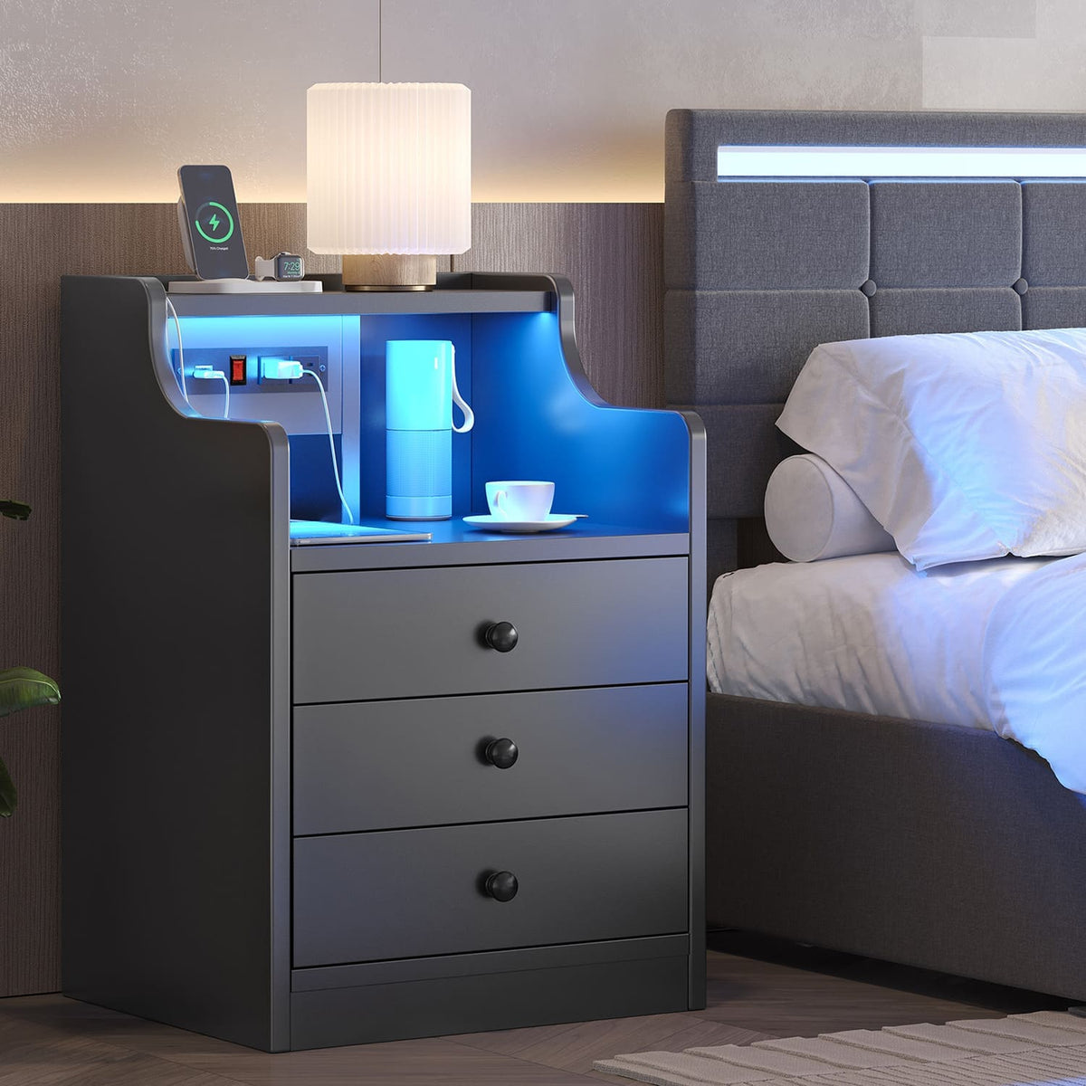 Black LED nightstand with three drawers, open shelf and integrated power panel