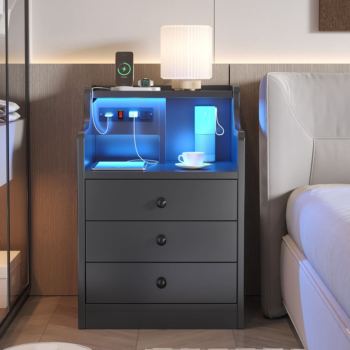 Black LED nightstand with three drawers, open shelf and integrated power panel
