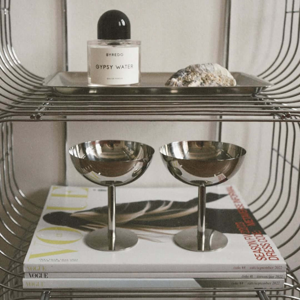 Silver stainless steel ice cream cup with a rounded bowl and pedestal base