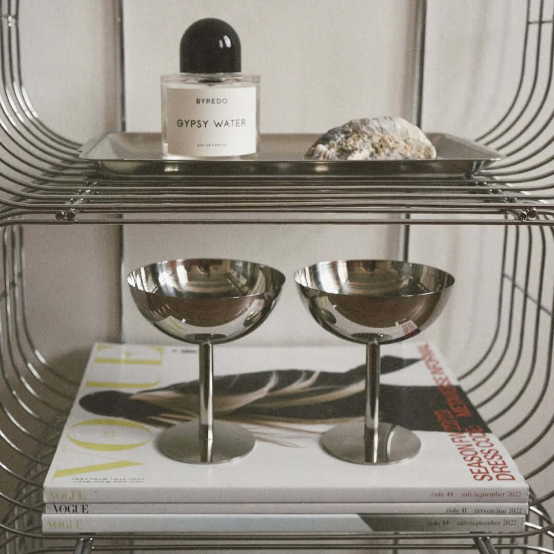 Silver stainless steel ice cream cup with a rounded bowl and pedestal base