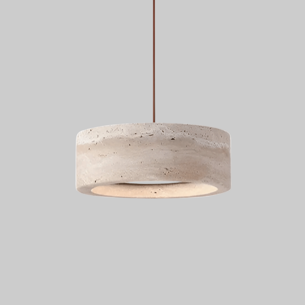 Beige textured travertine pendant light with black cord and ceiling mount