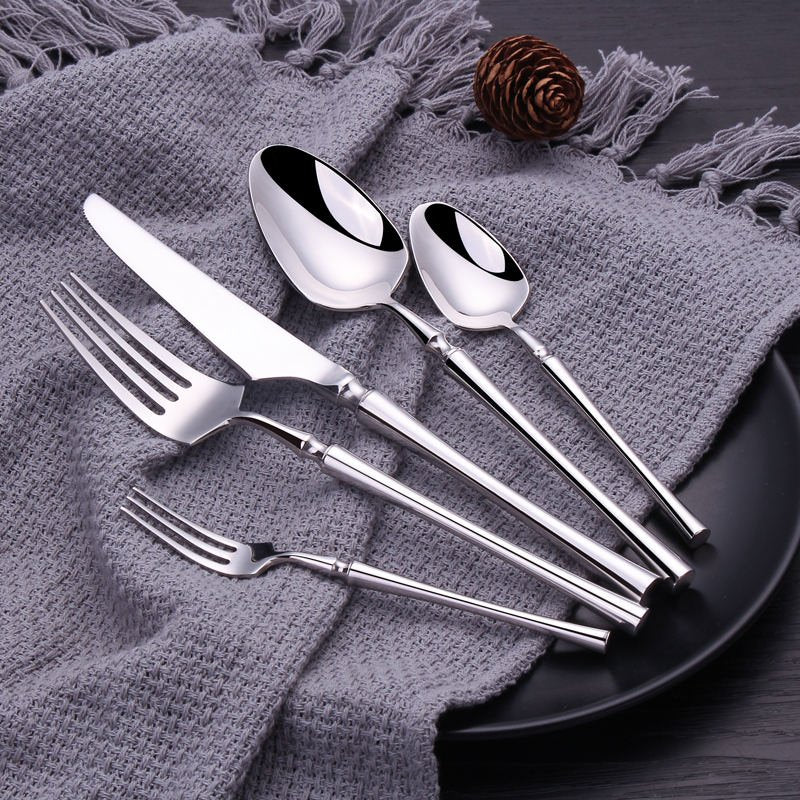 24-piece polished stainless steel cutlery set with knives, forks and spoons