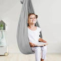 Children's hanging fabric sensory swing seat for indoor use