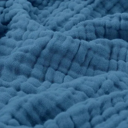 Soft textured blanket with a raised rippled surface