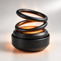 Portable coiled heater with circular base shown in black and red variants