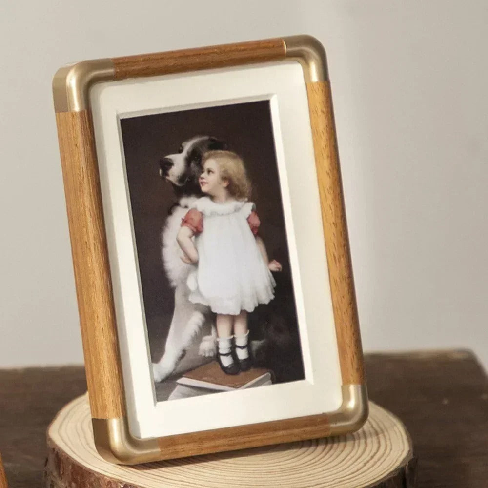 Tabletop photo frame with wood and brass-effect border