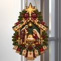 Christmas nativity door hanging decoration with star, ribbons, greenery and decorative lights