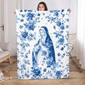 Blue floral fleece blanket with central religious figure