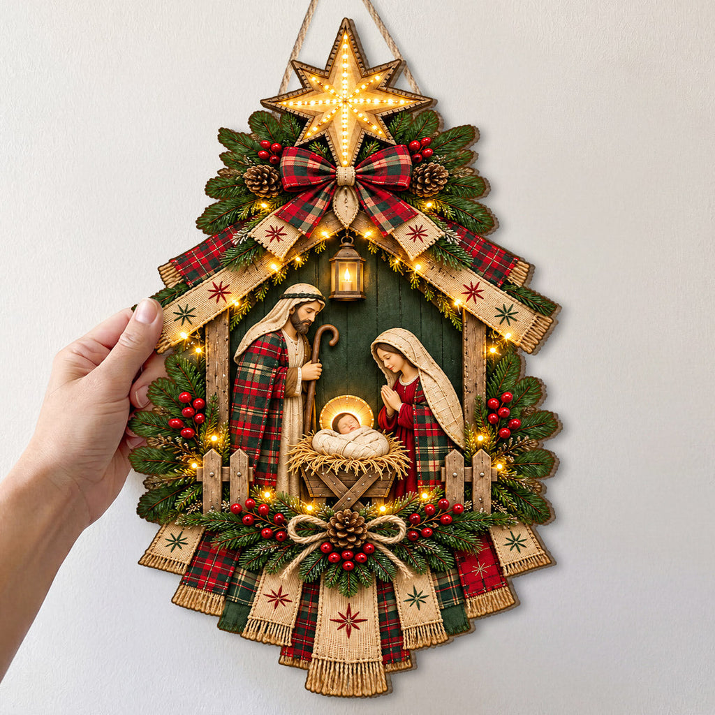 Christmas nativity door hanging decoration with star, ribbons, greenery and decorative lights