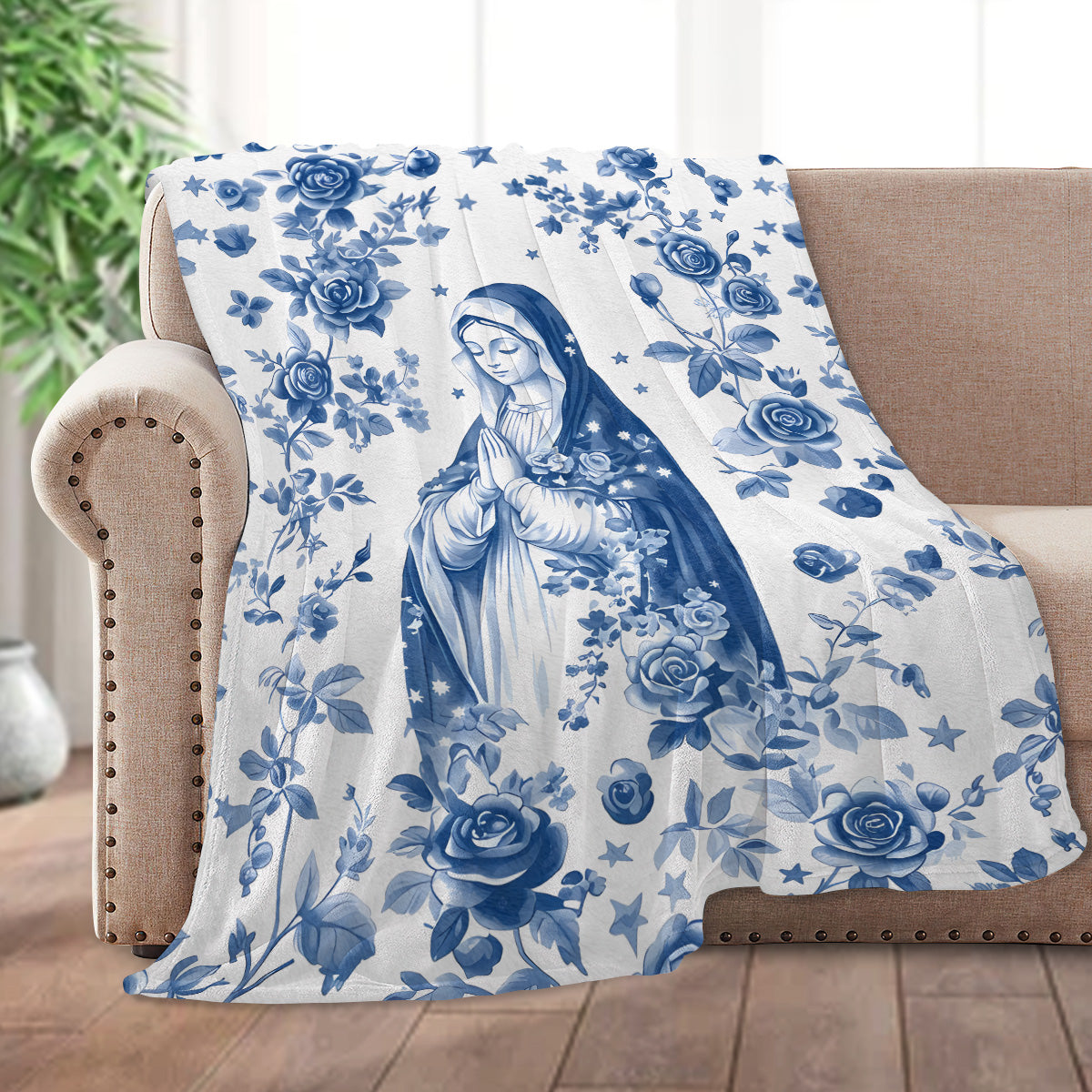 Blue floral fleece blanket with central religious figure