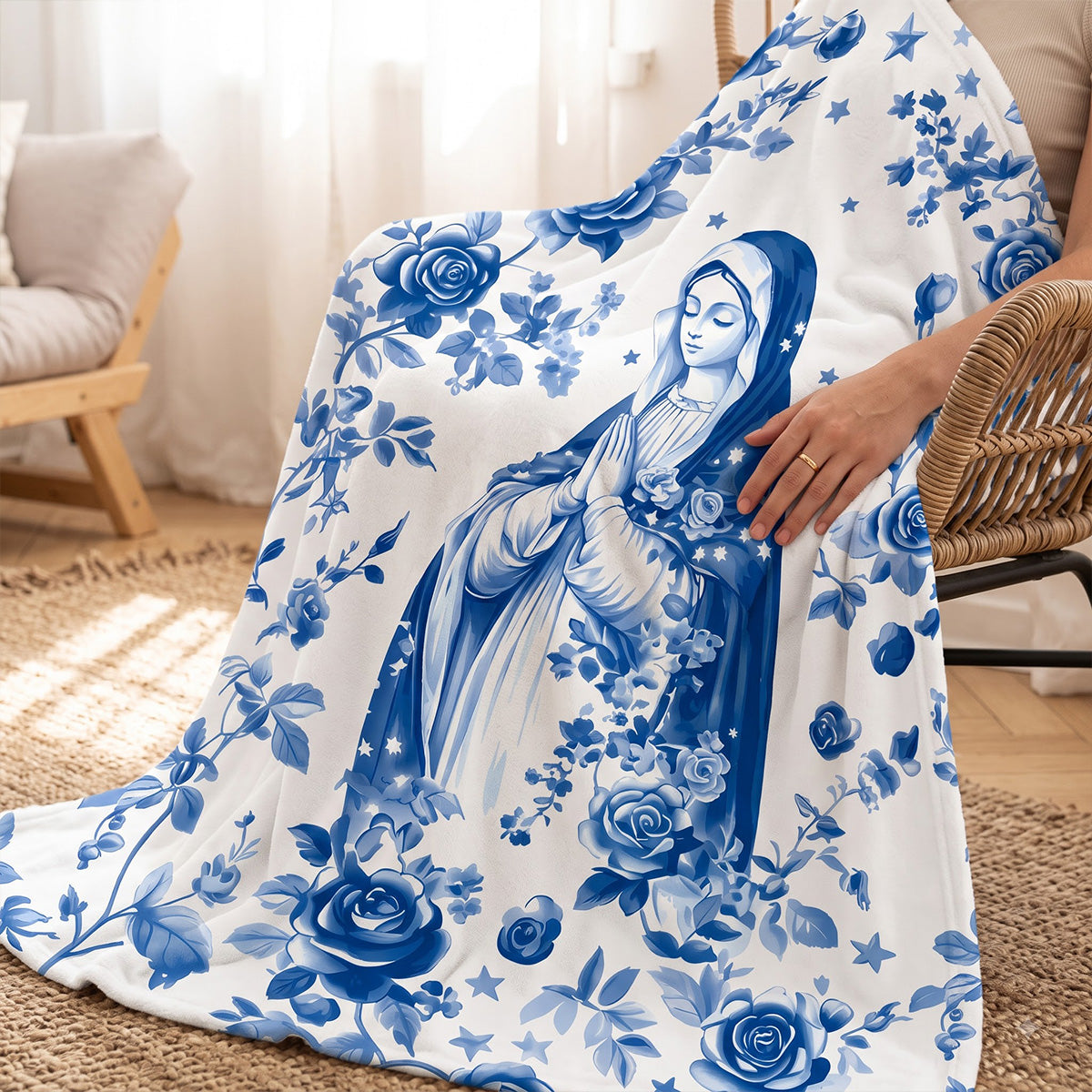 Blue floral fleece blanket with central religious figure