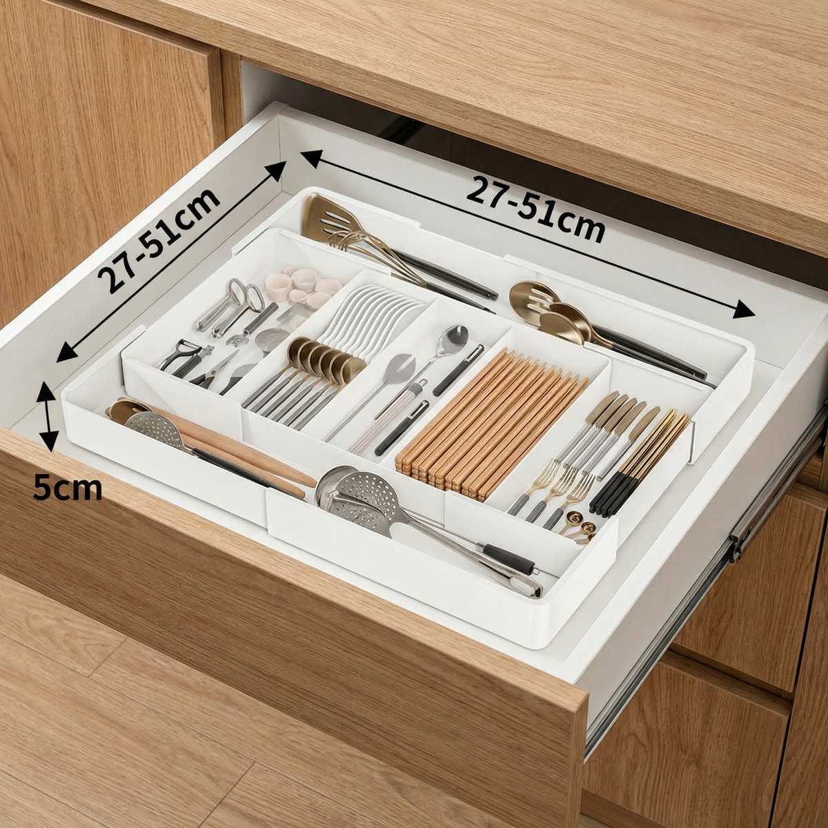 White adjustable cutlery drawer organiser with multiple kitchen utensil compartments