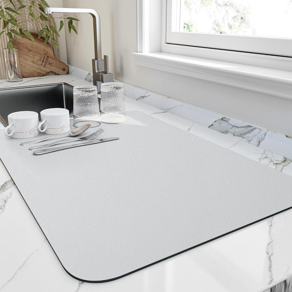 Rectangular textured kitchen mat with rounded corners and dark edging